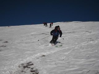 sci sulla neve e sull'erba
