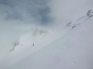 Il Colle dell' Autaret appare tra le nebbie.