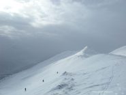 verso cima