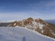 09 - dal colletto conviene togliere i ramponi per arrivare sulla cima per facili roccette