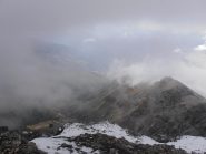 11 - dalla cima italiana della Punta Nera uno squarcio tra le nuvole permette di vedere Bardonecchia