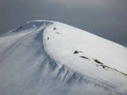 Demis ormai in fuga sulla dorsale finale