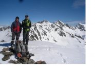 I soci posano per la foto di vetta..la prima ..e la Cima di Corborant alla loro dx