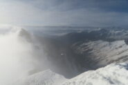 sulla sinistra il Pain de Sucre nella nebbia dalla cima del Fourchon